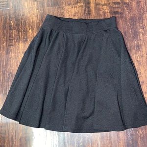 Black pleaded mini skirt